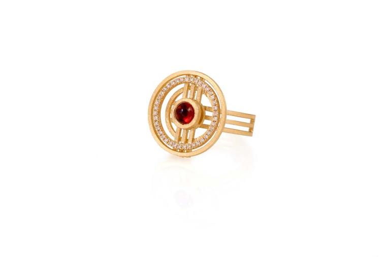 Shimell & Madden ring from the Orb collection in yellow gold with deep red cabochon garnets, orange sapphires and diamonds.